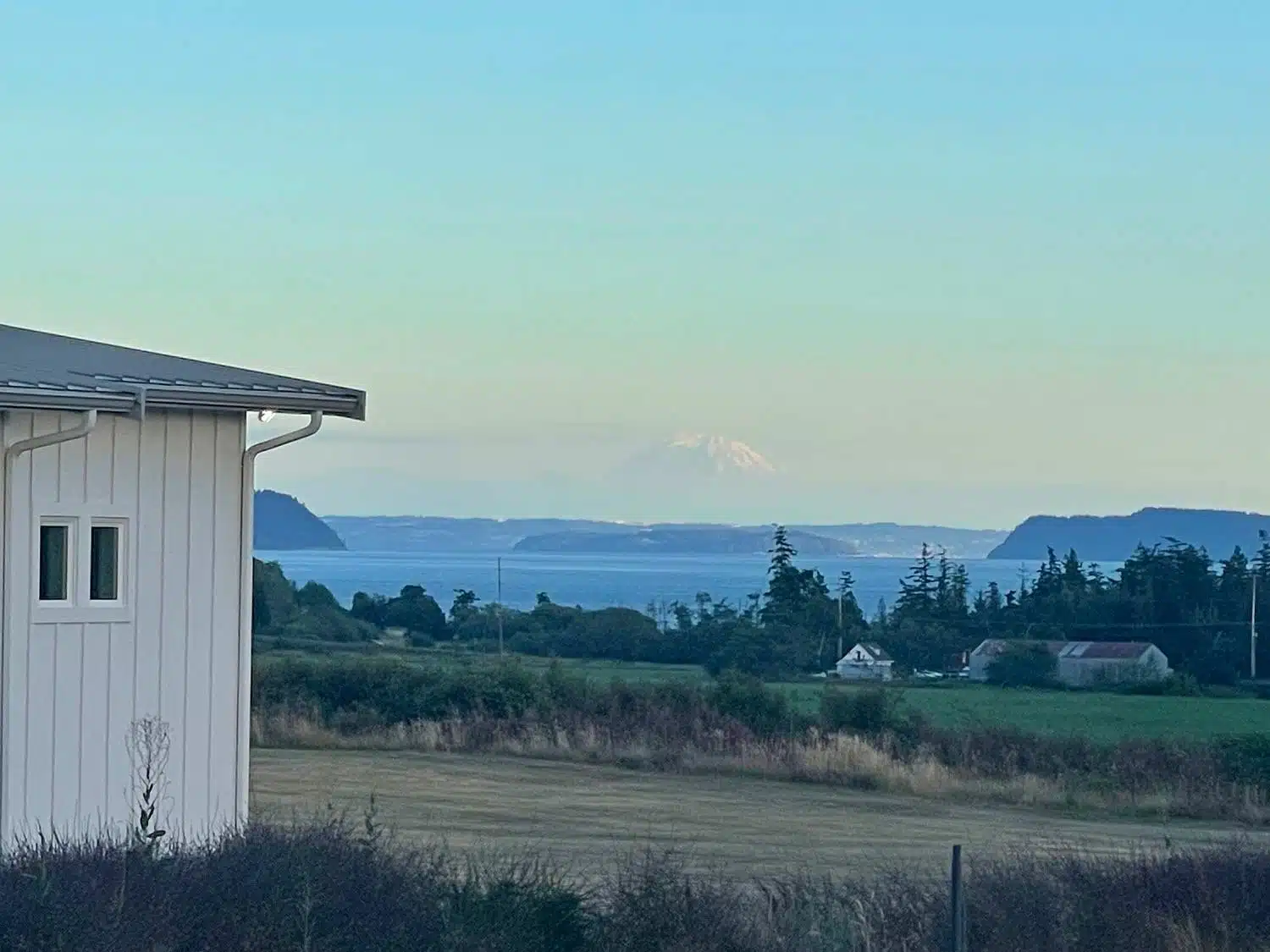 View of Mount Rainer and puget sound from Camano Island modern farm house