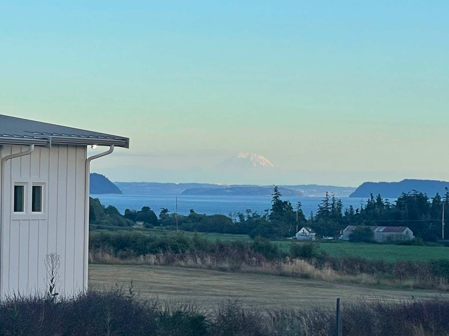 View of Mount Rainer and puget sound from Camano Island modern farm house