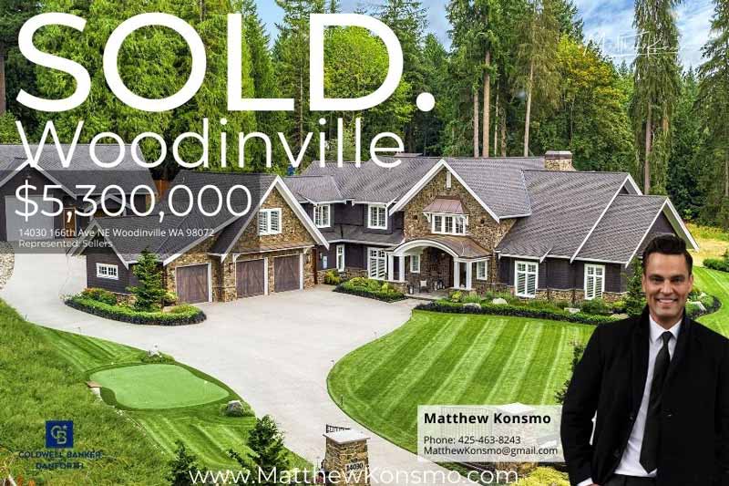Sold marketing graphic for a Woodinville Hollywood Hill luxury estate at 14030 166th Ave NE, Woodinville WA 98072 — aerial view of stone-and-shake mansion with circular drive, putting green, and forested backdrop, sold at $5,300,000 by Matthew Konsmo, broker with Coldwell Banker Danforth.