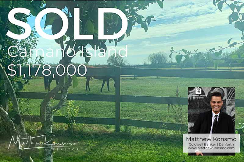 Sold marketing graphic for a Camano Island equestrian farm estate with horses grazing in a fenced pasture and water views beyond at $1,178,000 — professionally represented and sold by Matthew Konsmo, broker with Coldwell Banker Danforth.