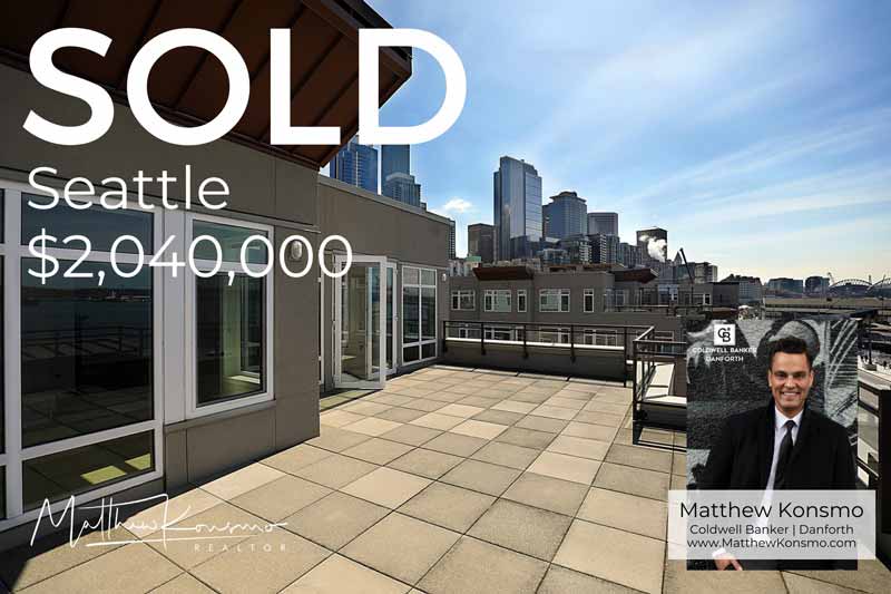 Sold marketing graphic for a Seattle waterfront condominium with a private rooftop terrace overlooking the downtown Seattle skyline and Puget Sound at $2,040,000 — professionally represented and sold by Matthew Konsmo, broker with Coldwell Banker Danforth.