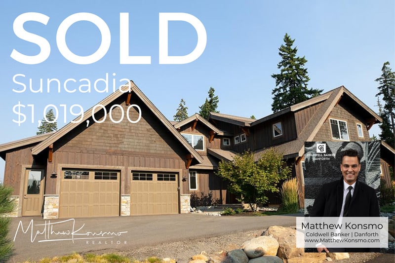 Sold marketing graphic for a mountain craftsman home at Suncadia Resort in Cle Elum, WA — cedar shake siding, stone accents, and three-car garage closed at $1,019,000 by Matthew Konsmo, Coldwell Banker Danforth.